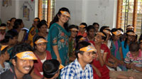Way of Hope Member talking with mentally challenged kid