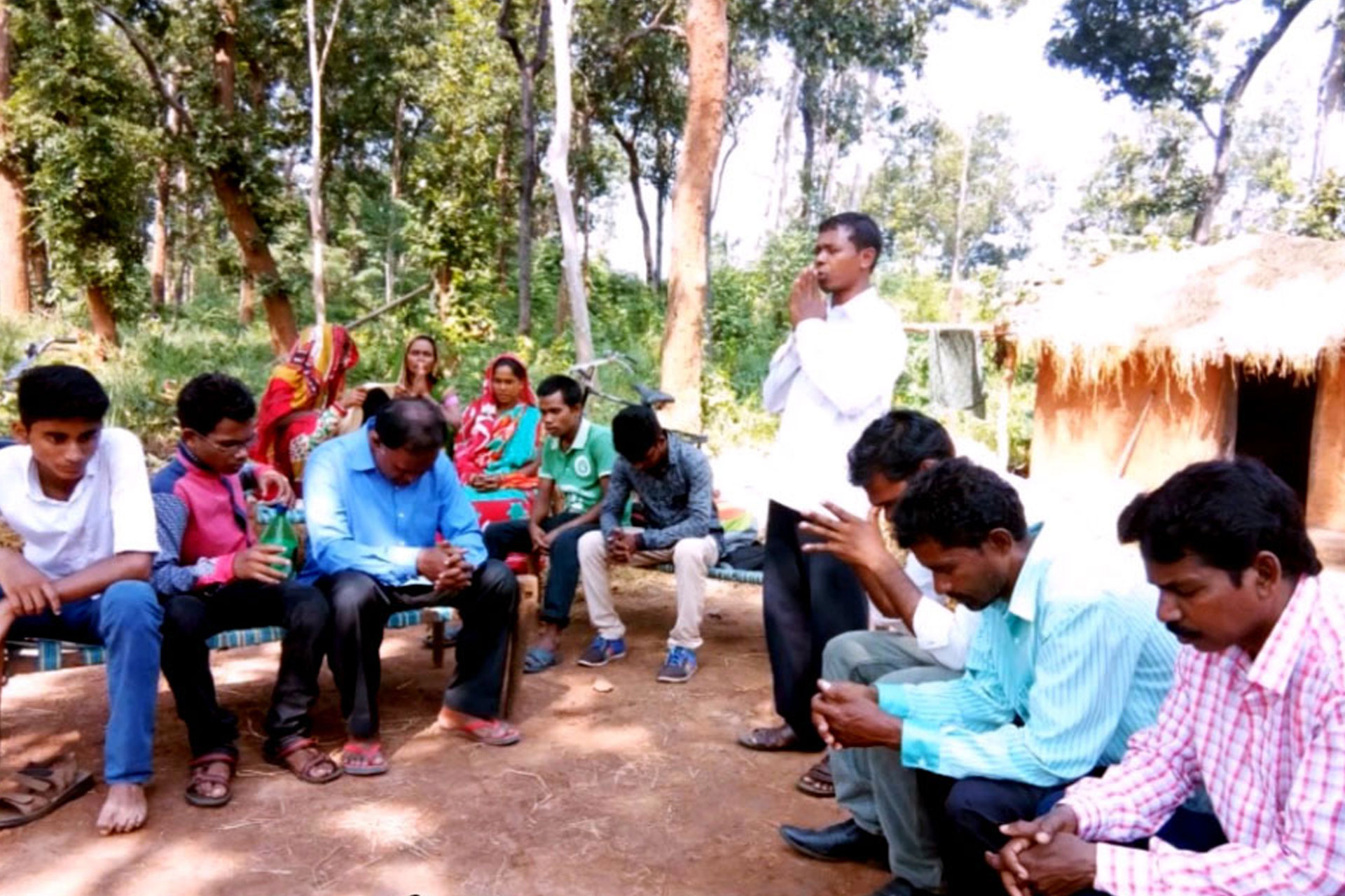 People praying in the open