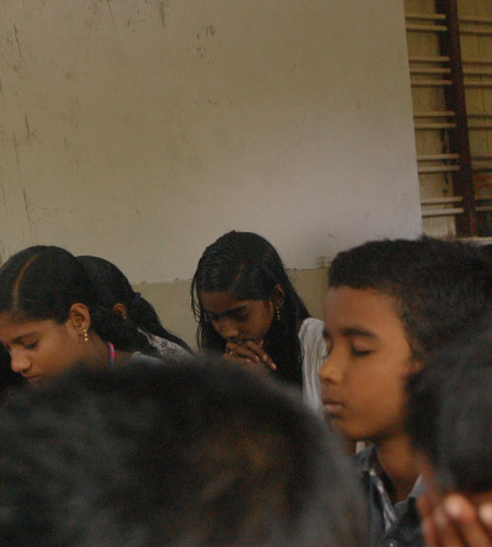 Children praying to God at WOH Meeting